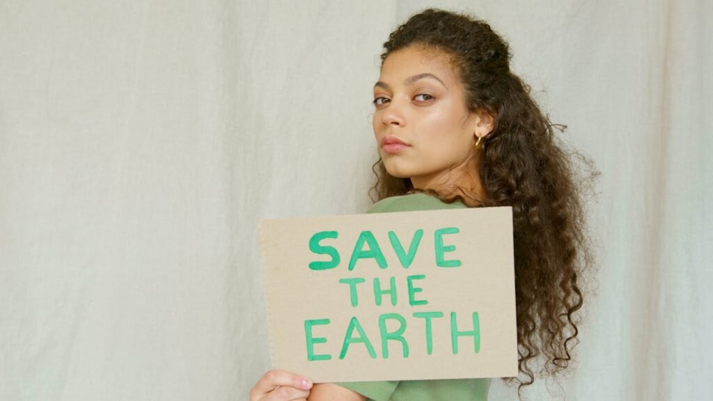 woman-holding-a-save-the-earth-cardboard-7048423 Save the Earth